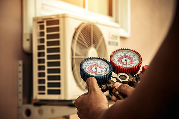 Professional Air Conditioning Service technician working in Columbus, NM